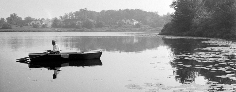 Photo of a man in a row boat on Walker's Pond circa 1955